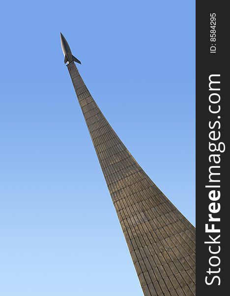 Monument of astronautics in Moscow.
Rocket in the blue sky.
