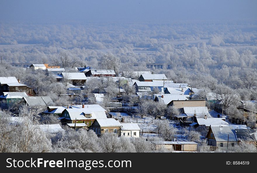 Rows of houses, forest, bridge and river in winter. Rows of houses, forest, bridge and river in winter
