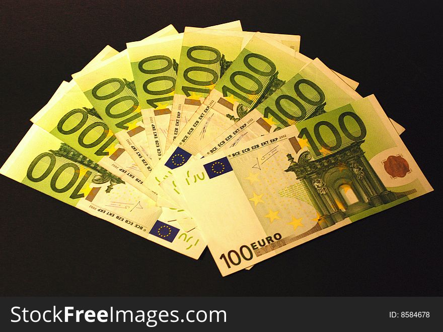 Eight paper currency with one hundred euro on black background. Eight paper currency with one hundred euro on black background