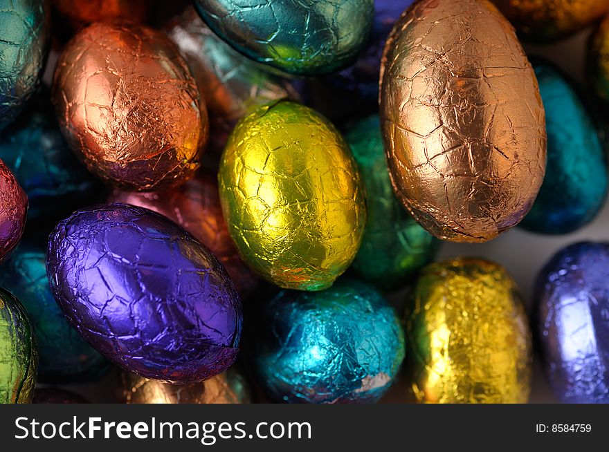 Many wrapped easter-eggs together, as background.