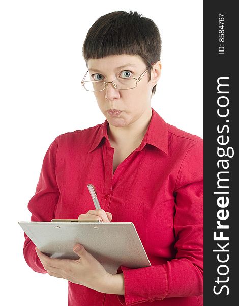 Strict manager woman in red shirt holds a notepad and looks into camera. Strict manager woman in red shirt holds a notepad and looks into camera.