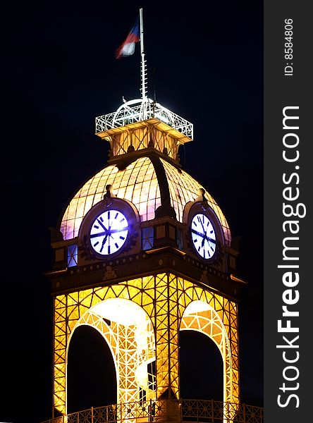 Central clock tower of industrial palace in Prague at night. Central clock tower of industrial palace in Prague at night