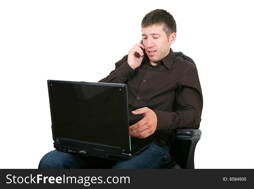 Businessman with laptop calling on by phone. Isolated