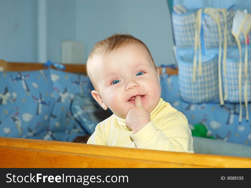 Infant girl with finger in mouth