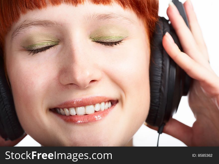 Beauty girl in head phones on white background