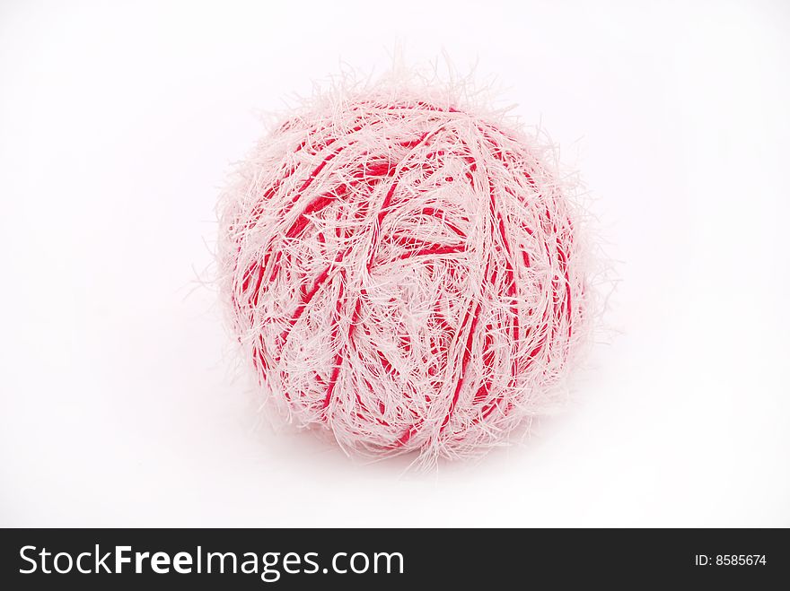 Red and white threads clew  isolated on a white background. Red and white threads clew  isolated on a white background