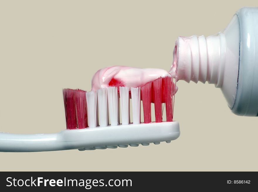 Tooth paste,toothbrush and tube on a light background