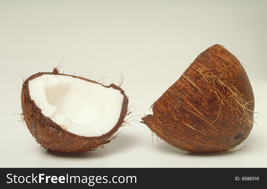 Coconut halves and white background