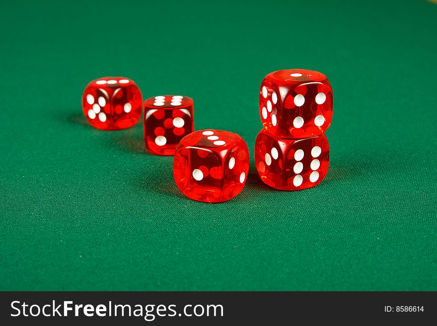 Red dice on green casino table. Red dice on green casino table