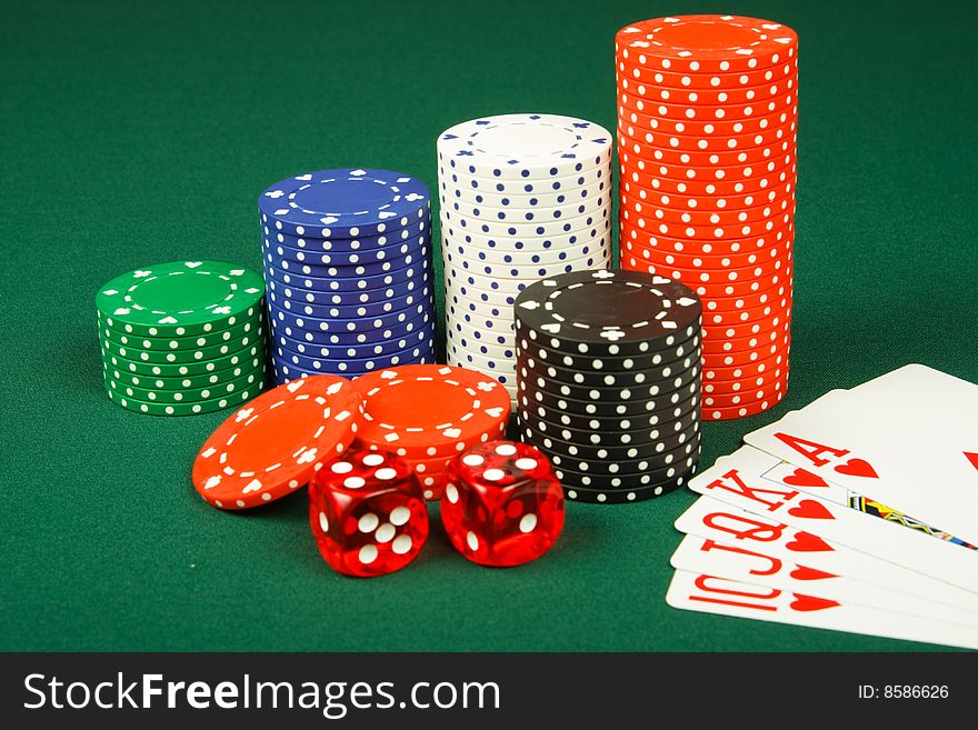 Chips ,dices and royal flush on casino table. Chips ,dices and royal flush on casino table