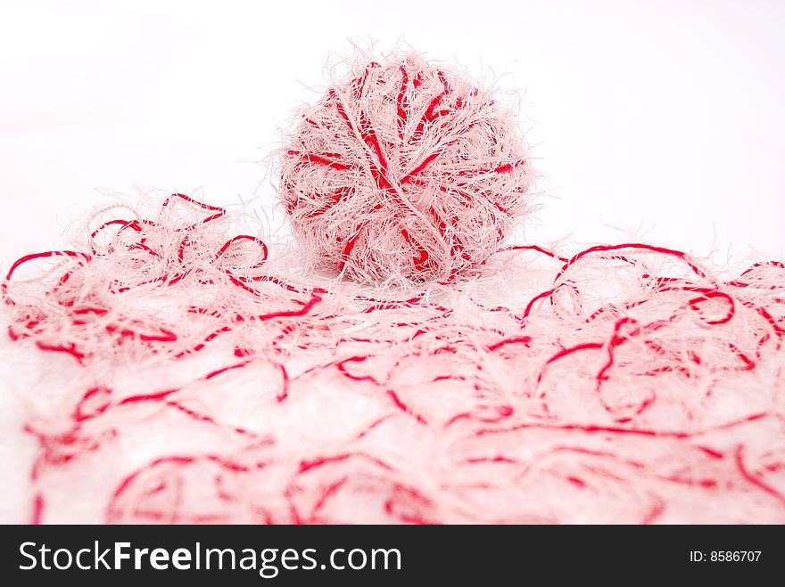 Red and white threads clew  isolated on a white background. Red and white threads clew  isolated on a white background