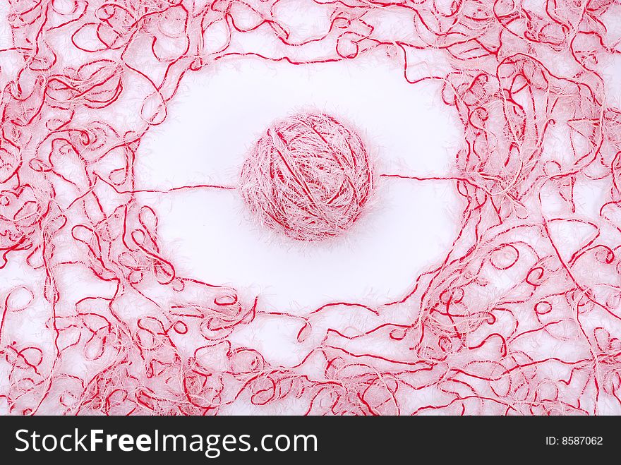 Red and white threads clew  isolated on a white background. Red and white threads clew  isolated on a white background