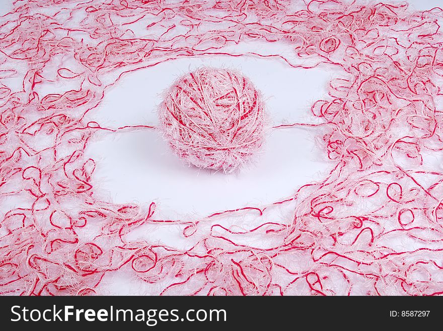 Red and white threads clew  isolated on a white background. Red and white threads clew  isolated on a white background