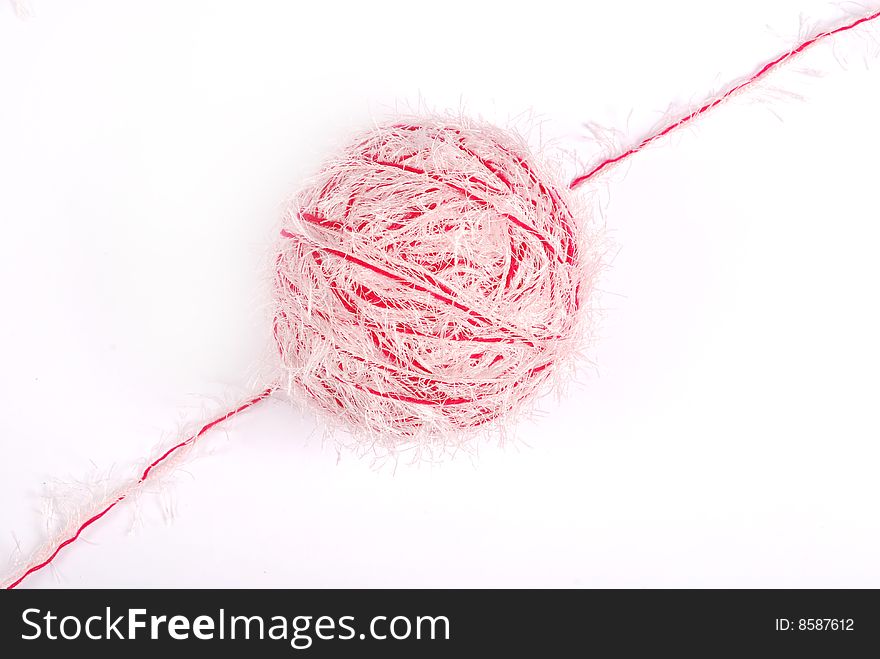 Red and white threads clew  isolated on a white background. Red and white threads clew  isolated on a white background