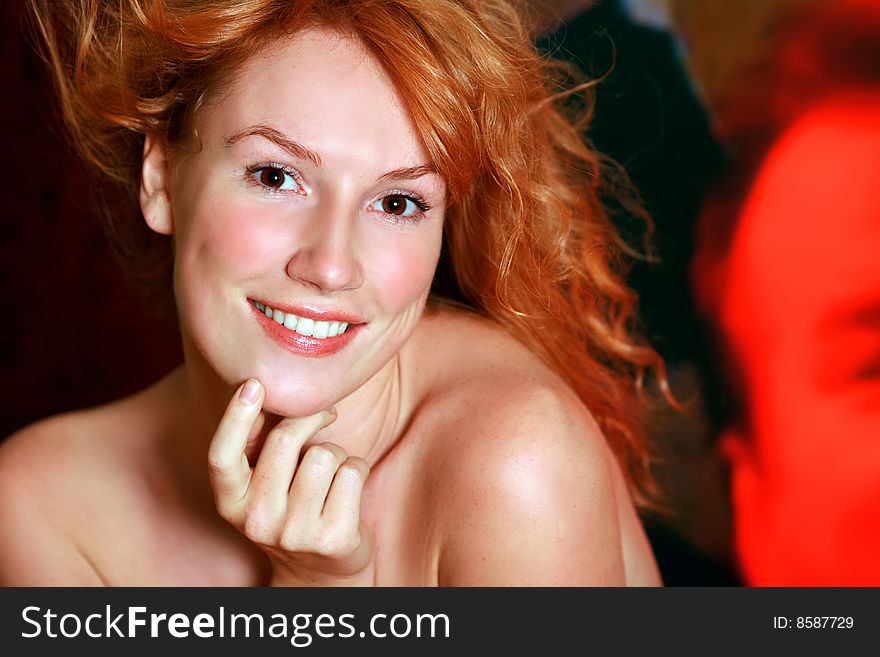 Portrait of the beautiful red-haired girl looking in an objective. Portrait of the beautiful red-haired girl looking in an objective