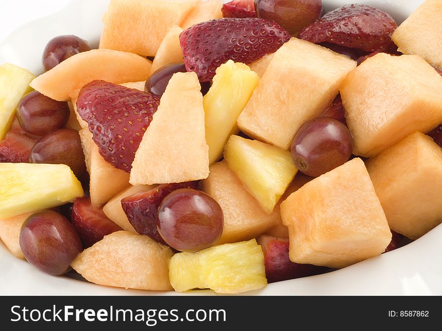 Closeup of cut mixed fresh fruit in bowl. Closeup of cut mixed fresh fruit in bowl