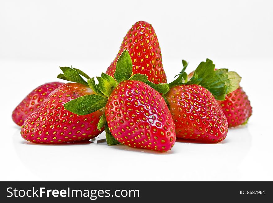 Delicious red strawberries isolated on a white background