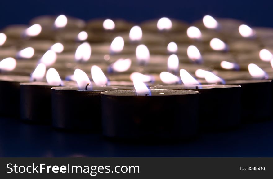 Burning candles close up view.