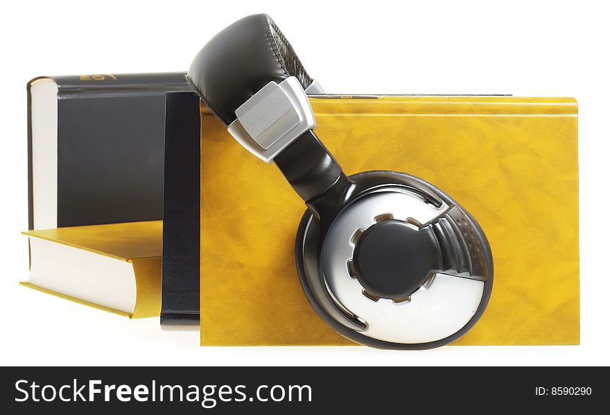 headphones and books isolated on white