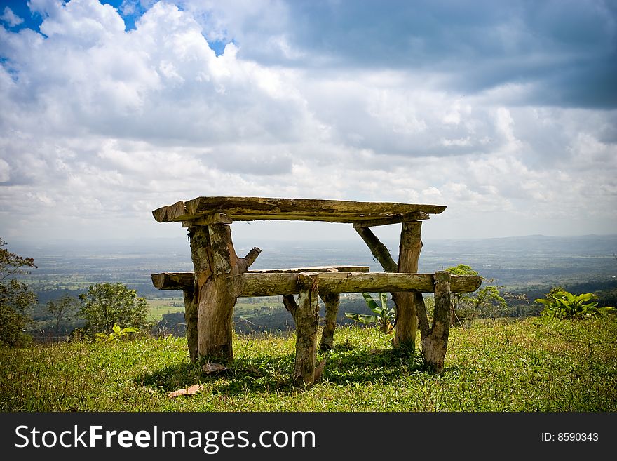 Wooden table with benches up on the hill. Wooden table with benches up on the hill