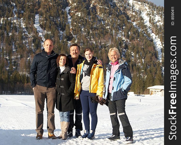 Family in a and outdoor winter setting. Family in a and outdoor winter setting.