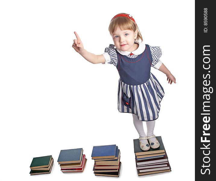 Little girl with book on white background