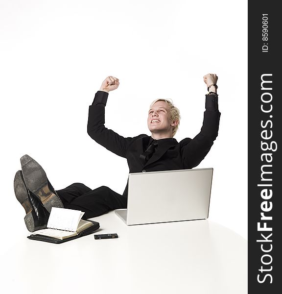 Happy boy siting infront of a computer