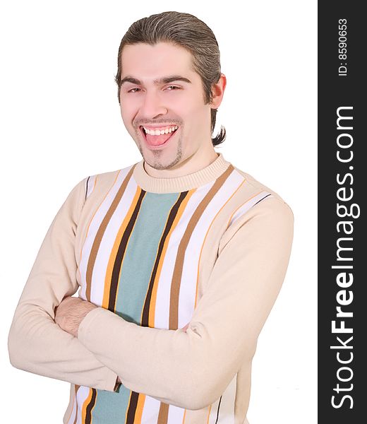 Young dark haired caucasian man in striped sweater making silly face and showing tongue isolated on white. Young dark haired caucasian man in striped sweater making silly face and showing tongue isolated on white