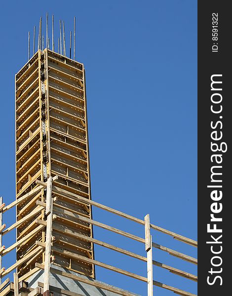 Wooden Scaffolding with Yellow Unfinished Metal Components