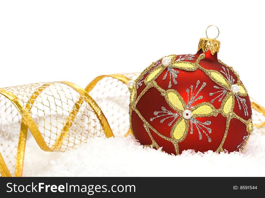 Red Christmas ball on snow background