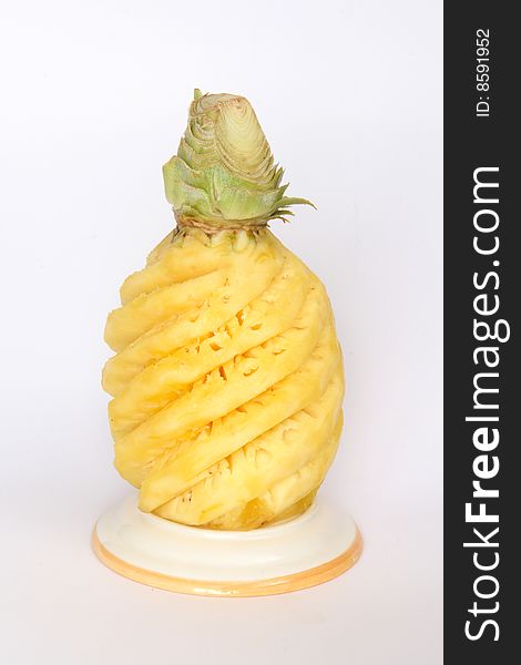 Whole peeled pineapple, a tropical fruit. Whole peeled pineapple, a tropical fruit
