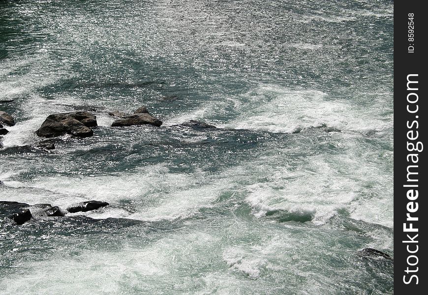 Large green river and rock