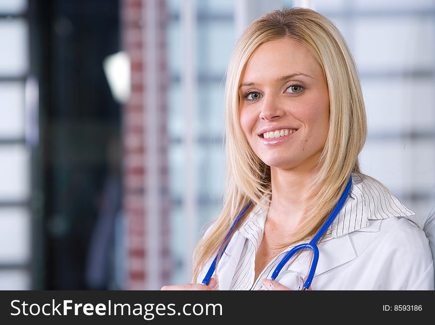 Young female doctor standing in a modern office