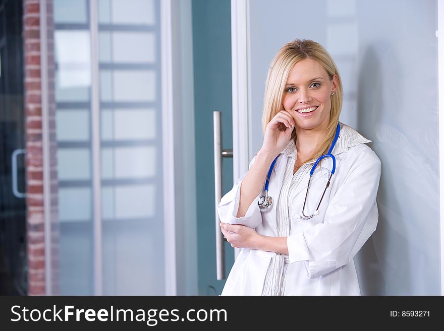 Young female doctor standing in a modern office