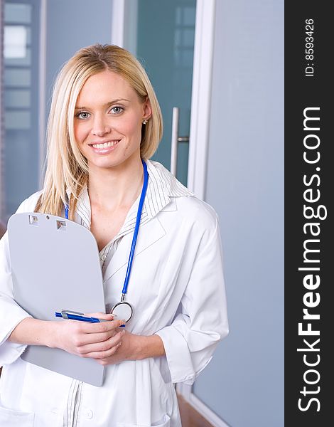 Woman doctor holding a chart in a modern office