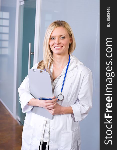 Woman doctor holding a chart in a modern office