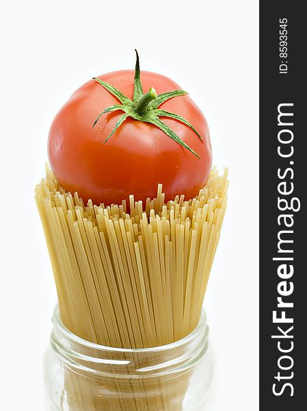 Spaghetti and mature tomato isolated on a white background