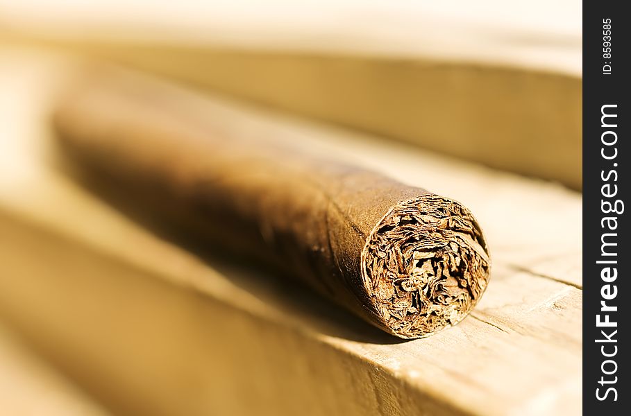 Cigar on wooden  background (shallow DOF)