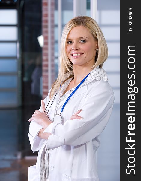 Young female doctor standing in a modern office