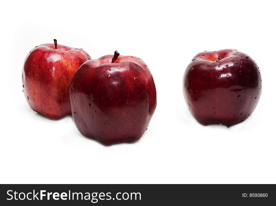 Three red apples, in droplet grow insulated on white background. Three red apples, in droplet grow insulated on white background