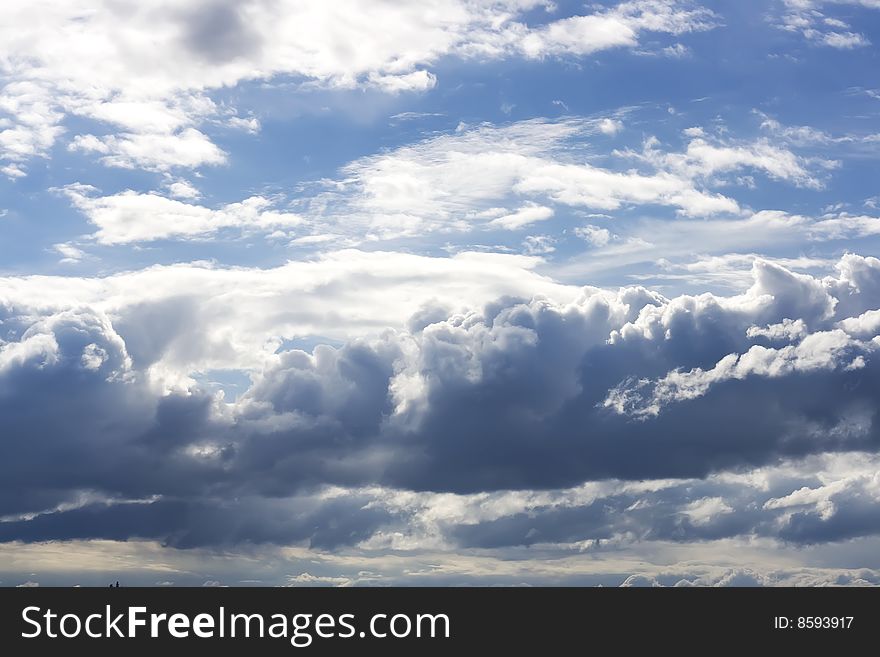 Colorful blue sky with storm clouds. Colorful blue sky with storm clouds