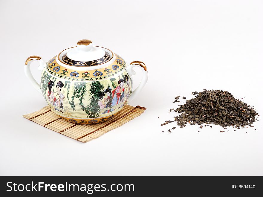 Tea and coffee. A small white teapot. Tea and coffee. A small white teapot.