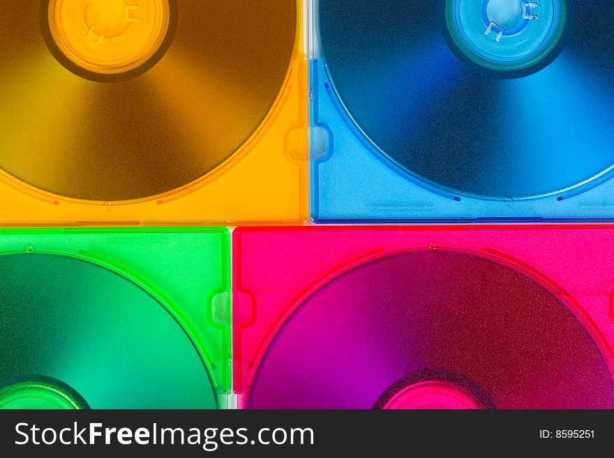 Computer disks in multiciolored boxes technology background