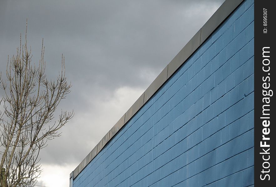 A blue industrial brick building. A blue industrial brick building