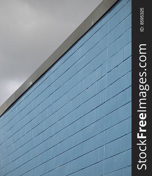 A blue industrial brick building. A blue industrial brick building