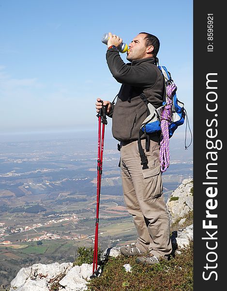 Man In A Top Of A In Mountain Hiking