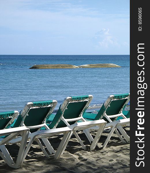 Blue chairs on a tropical beach. Blue chairs on a tropical beach