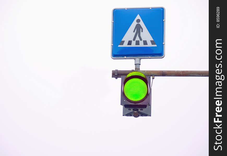 Go light showing green at a pedestrian  crossing. Go light showing green at a pedestrian  crossing