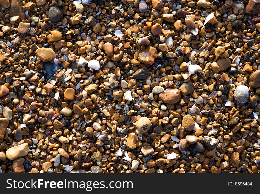 Background shot of pebbles on a beach. Background shot of pebbles on a beach