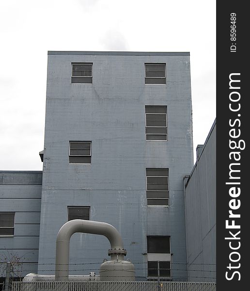 Large industrial building with pipes